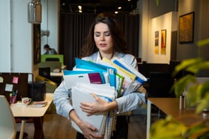 woman-holding-lots-folders